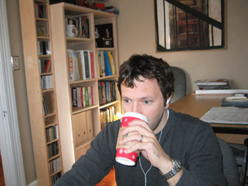 Me sitting at my computer with coffee and iPod